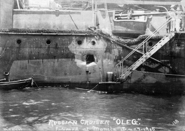 One of the few Russian cruises to survive the battle, shown with a large hole in the hull.
