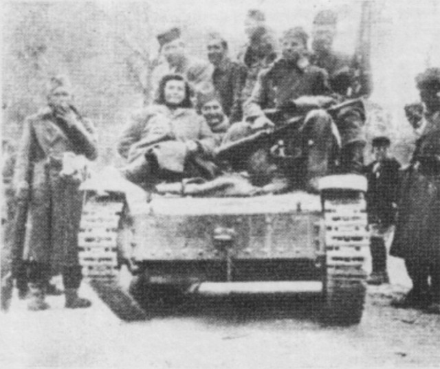 Partisans of the Main Operational Group on the tank captured from the Italians in late February 1943.