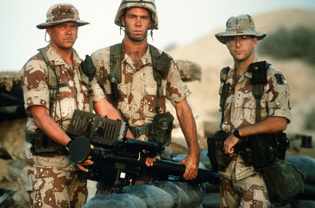 Members of Btry. A, 5162nd Air Defense Arty. Regt., 11th Air Defense Arty. Bde., hold an FIM-92A Stinger portable missile launcher as they pose for a photograph during Operation Desert Shield. (USAF PHOTO BY SSGT F. LEE CORKRAN DA-ST-92-06695)