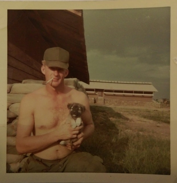 Robert Cliburn, is pictured in 1968 with Lee Lee, a dog he purchased in Vietnam and which accompanied his tank crew during their missions. When leaving Vietnam, the dog was placed in the care of soldiers remaining in country. Courtesy of Robert Cliburn