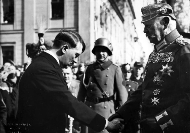 Hitler humbly greeting Hindenburg after the Enabling Act became in effect