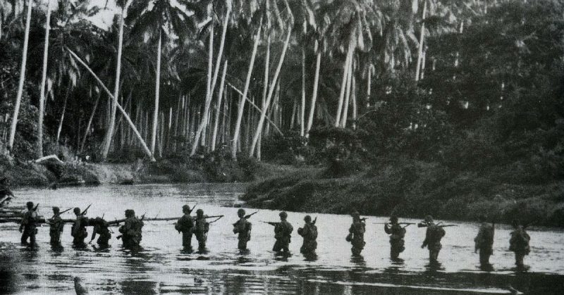 A U.S. Marine patrol crosses the Matanikau River in September 1942.