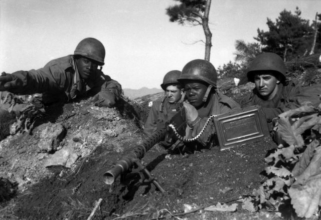 Soldiers from the U.S. 2nd Infantry Division in action near the Ch'ongch'on River, 20 November 1950.