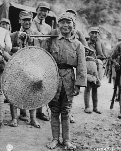 Chinese boy hired to assist troops of Chinese 39th Division during the Salween Offensive, Yunnan Province, China,1944 (ww2db.com)
