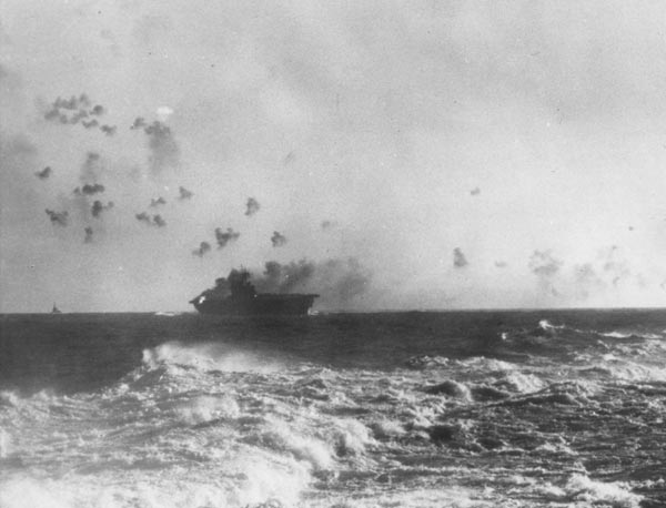 The carrier USS Enterprise (CV-6) under aerial attack during the Battle of the Eastern Solomons.