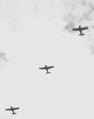 U.S. Marine F4F Wildcats head-out from Henderson Field, Guadalcanal, probably in August or September 1942, to intercept incoming Japanese aircraft.