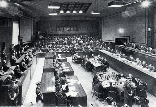View of the Tribunal in session: the bench of judges is on the right, the defendants on the left, and the prosecutors in the back.