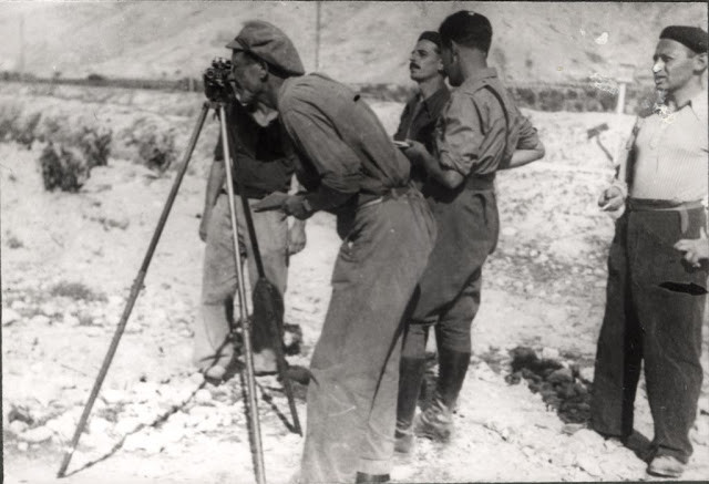 Koca Popovic, a gunner, observe the enemy positions. 1937