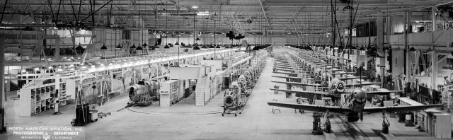 This glorious panorama shows the Mustang final assembly line at Inglewood, almost beginning to end. Wings are on the left with fuselages coming together nearby. Note the suspended tail and engines being added after the U-turn on the floor. On the right, after the wing join, nearly whole Mustangs get finishing touches as they migrate toward the factory doors. Santa Maria Museum of Flight
