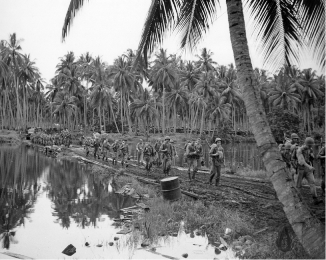 The U.S. Army's 182nd Infantry Regiment on the march during the Battle of Guadalcanal. Photo Credit.
