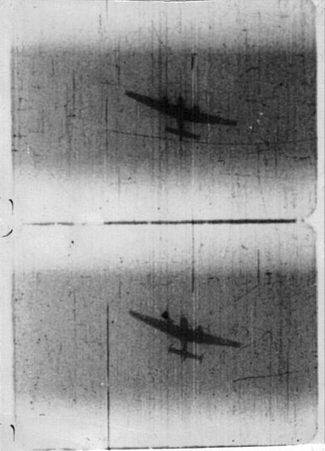 Messerschmitt Bf 110 under attack from a Spitfire, caught on the latter’s gun camera film.