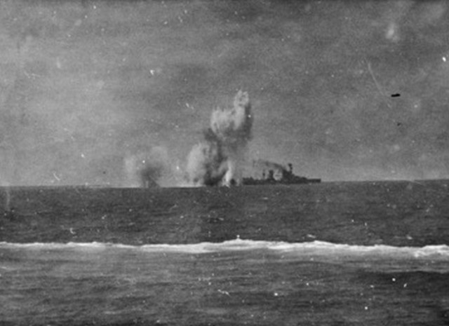 The bombardment of a Netherlands cruiser during the Battle of the Java Sea. By This image is available from the Collection Database of the Australian War Memorial under the ID Number: 305183