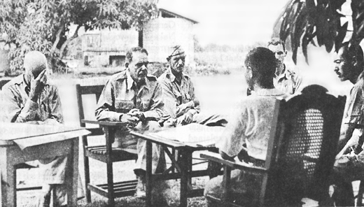 Edward King discusses terms of surrender with Japanese officers.