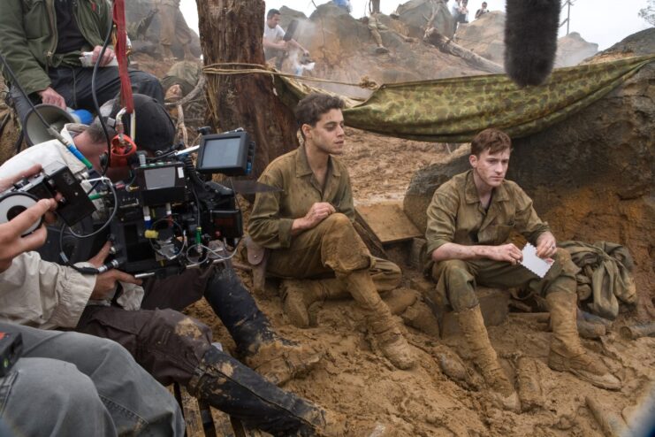 Rami Malek, Joseph Mazzello and crew members on the set of 'The Pacific'