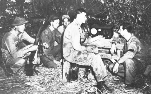 Allied troops listen to Voice of Freedom broadcast.