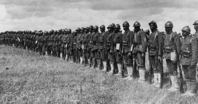 15th Infantry in France, wearing French helmets.