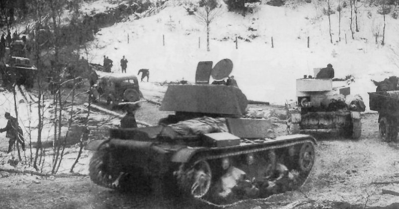 Soviet T-26 light tanks and GAZ-A trucks of the Soviet 7th Army during its advance on the Karelian Isthmus, December 2, 1939.