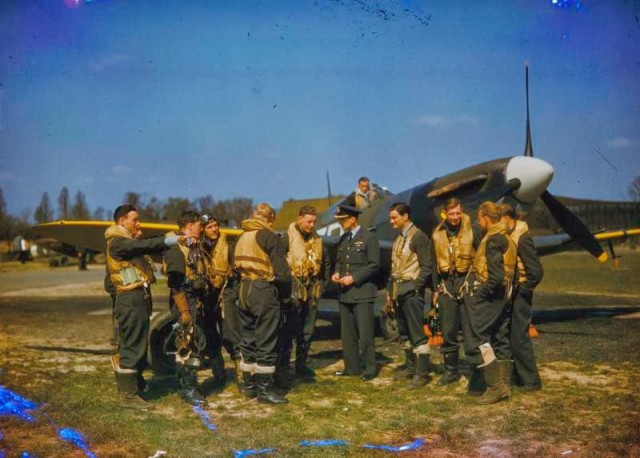 RAF pilots in front of a Spitfire, England, 1939-1945. © IWM (COL 192)