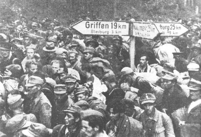 The retreating column of Germans and their colaborationists, May 1945. By Unknown - , Public Domain, 