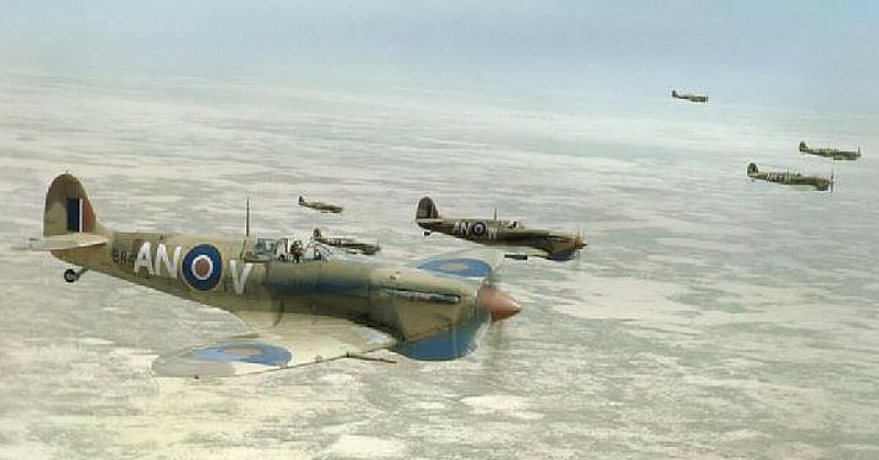 Supermarine Spitfire Mk Vbs of No. 417 Squadron, Royal Canadian Air Force, flying in loose formation over the Tunisian desert on a bomber escort operation, April 1943.
