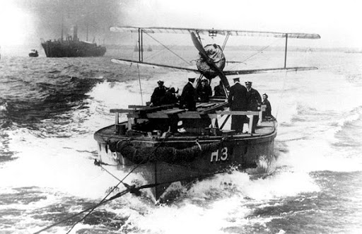 Another Thorneycroft Seaplane Lighter during World War I, this one carrying what appears to be a Sopwith Pup fighter of the Royal Naval Air Service