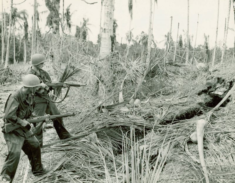 American Soldiers clearing a Japanese bunker near Buna, New Guinea. 