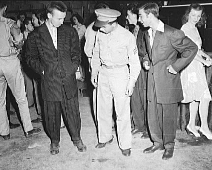 A soldier with two men wearing zoot suits in Washington D.C., 1942