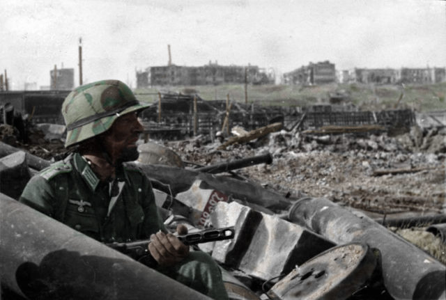 A German Oberleutnant with a Soviet PPSh-41 submachine gun in Barrikady factory rubble. Photo Credit.
