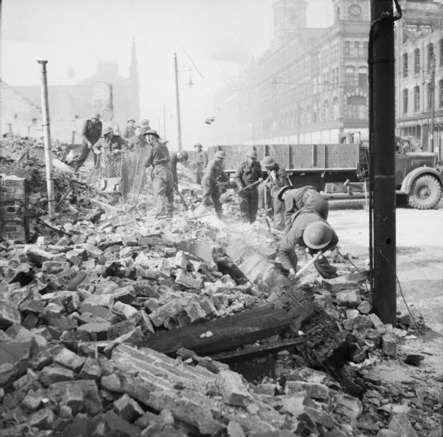 Soldiers clearing rubble after the air raid.