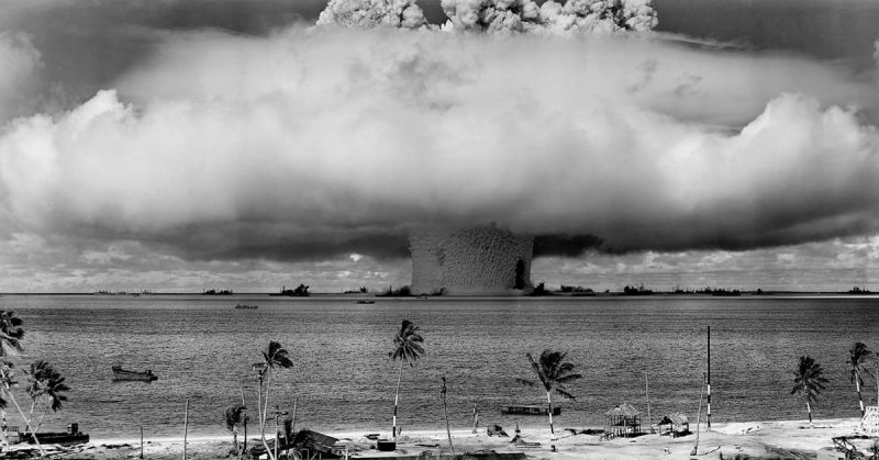 Mushroom-shaped cloud and water column from the underwater Baker nuclear explosion of July 25, 1946. Photo taken from a tower on Bikini Island, 3.5 miles (5.6 km) away.