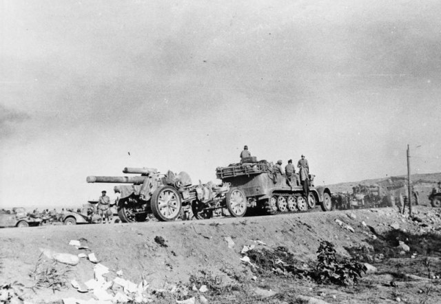 German 15 cm heavy artillery howitzers being towed by Sd.Kfz. 9 "Famo" half trucks towards El Alamein during the first battle. July 1942 [via]