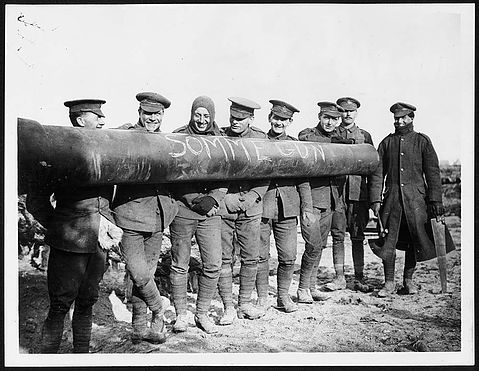 'Some jolly gunners and their pet.'