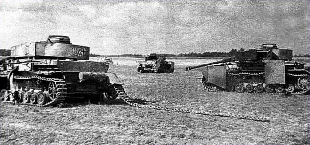 Destroyed German armour litter the fields​ all over the way [via]