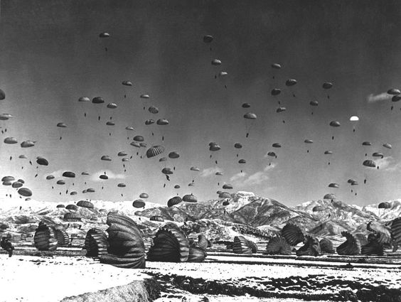 Korean War. Men and equipment being parachuted to earth in an operation conducted by United Nations airborne units.