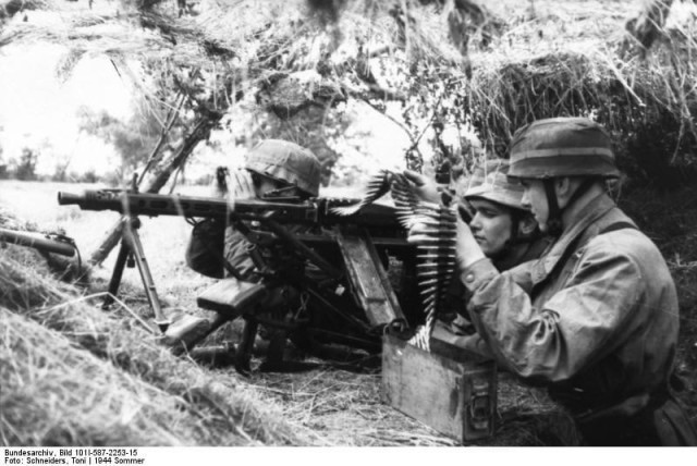 German Fallschirmjager Trüppen in Normandy, the German Parachute forces fighting in an infantry role were very effective in the Normandy campaign. These machine guns would cause most of the casualties on D-Day and were one of the most feared weapons on the battlefields of World War Two. June 1944 (Image).