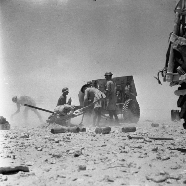 A 25-pdr field gun of 11th Field Regiment, Royal Artillery, in action. July 1942 [via]