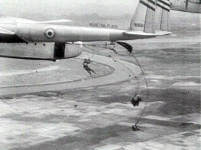 French Union paratroopers dropping from a C-119 transport during the battle at Dien Bien Phu.