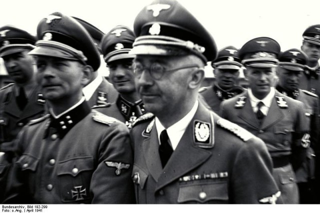 The 1941 SS tour of Mauthausen concentration camp headed by Heinrich Himmler (center). Otto Kumm (front row, left), Wilhelm Bittrich and Paul Hausser, who later became key figures in HIAG, took part. 