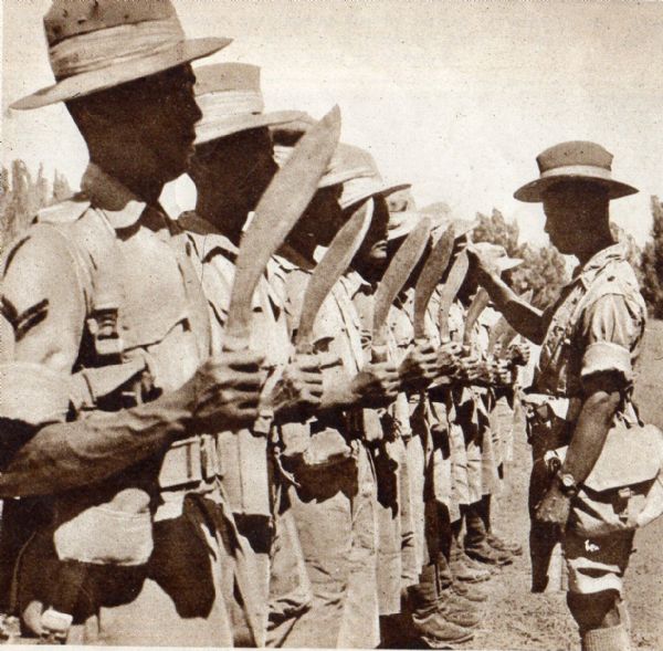 Ghurkas and their famed Kukri blade being inspected