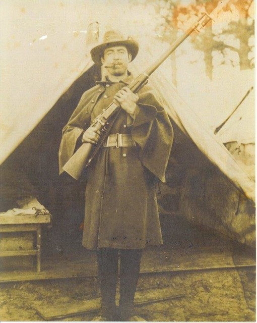 Jacob Houston is pictured in uniform in 1898 with a Krag-Jorgensen .30-40 rifle. A farmer from Miller County, Houston served as a private with Company B, Sixth Missouri Volunteer Infantry during the Spanish-American War. Courtesy of the Houston family