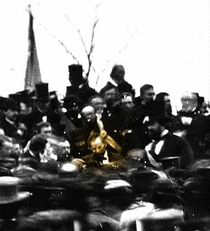 President Lincoln (gold spotlight) giving the Gettysburg Address. photo via Wikipedia 