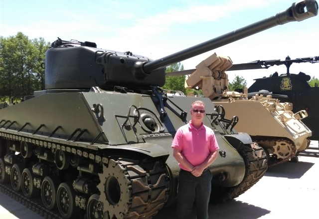 Charles Machon, director of the Museum of Missouri Military History in Jefferson City, Mo., stands next to the Sherman tank now on display at the museum. The tank was restored through the assistance of Xtreme Body & Paint and the Sante Fe Chapter of the Military Vehicle Preservation Association. Courtesy of Jeremy P. Ämick 