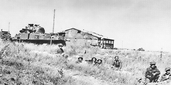 The Queen's Own Rifles of Canada dug in at the end of D-Day near Carpiquet. Public Domain.