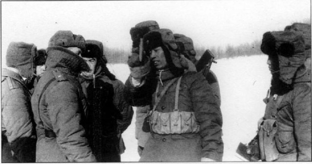 Chinese border guard (on the right) waving Mao's "Red Book" in front of a Soviet border guard