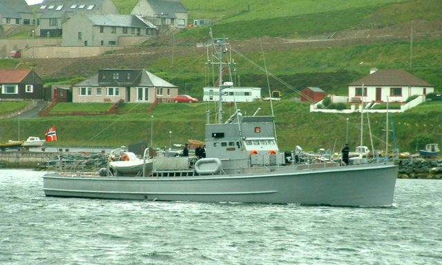 HNoMS Hitra entering Scalloway harbour, 20 June 2003. Photo Credit.