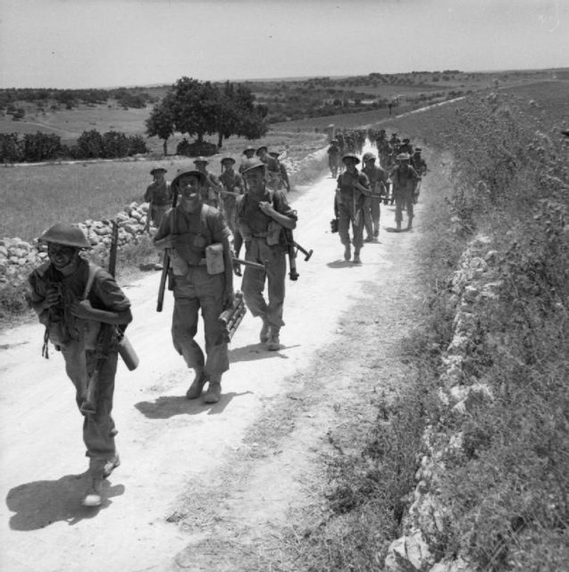 The British Army in Sicily 1943 Men of the 2nd Seaforth Highlanders advance along a road near Noto, 11 July 1943. [© IWM (NA 4306)]