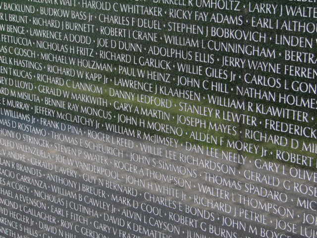 Names honoring the fallen and those missing, as seen on a small section of the wall. Photo via Hu Totya and Wikipedia. 