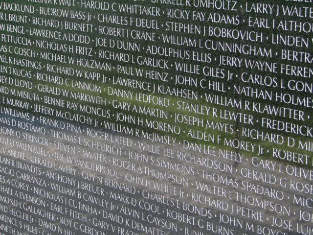 Names honoring the fallen and those missing, as seen on a small section of the wall. Photo via Hu Totya and Wikipedia.