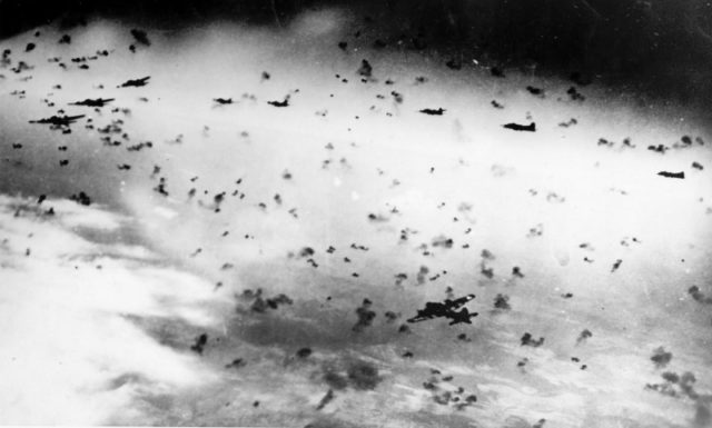 US bombers B-17 of the 303rd Bomb Group flying in the gaps of the German anti-aircraft shells [Via].