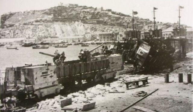Remains of the Italian Navy armed train "T.A. 76/2/T", destroyed by USS Bristol while opposing the landing at Licata. [Public Domain]